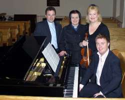 L to R:  The Rev Paul Dundas - Rector, the Rev Diane Matchett - Curate, Hayley Howe - Violinist and Richard Yarr - Organist (seated at piano) pictured at the first of three lunchtime concerts entitled ‘Music in May’ in Christ Church Parish on May 15.